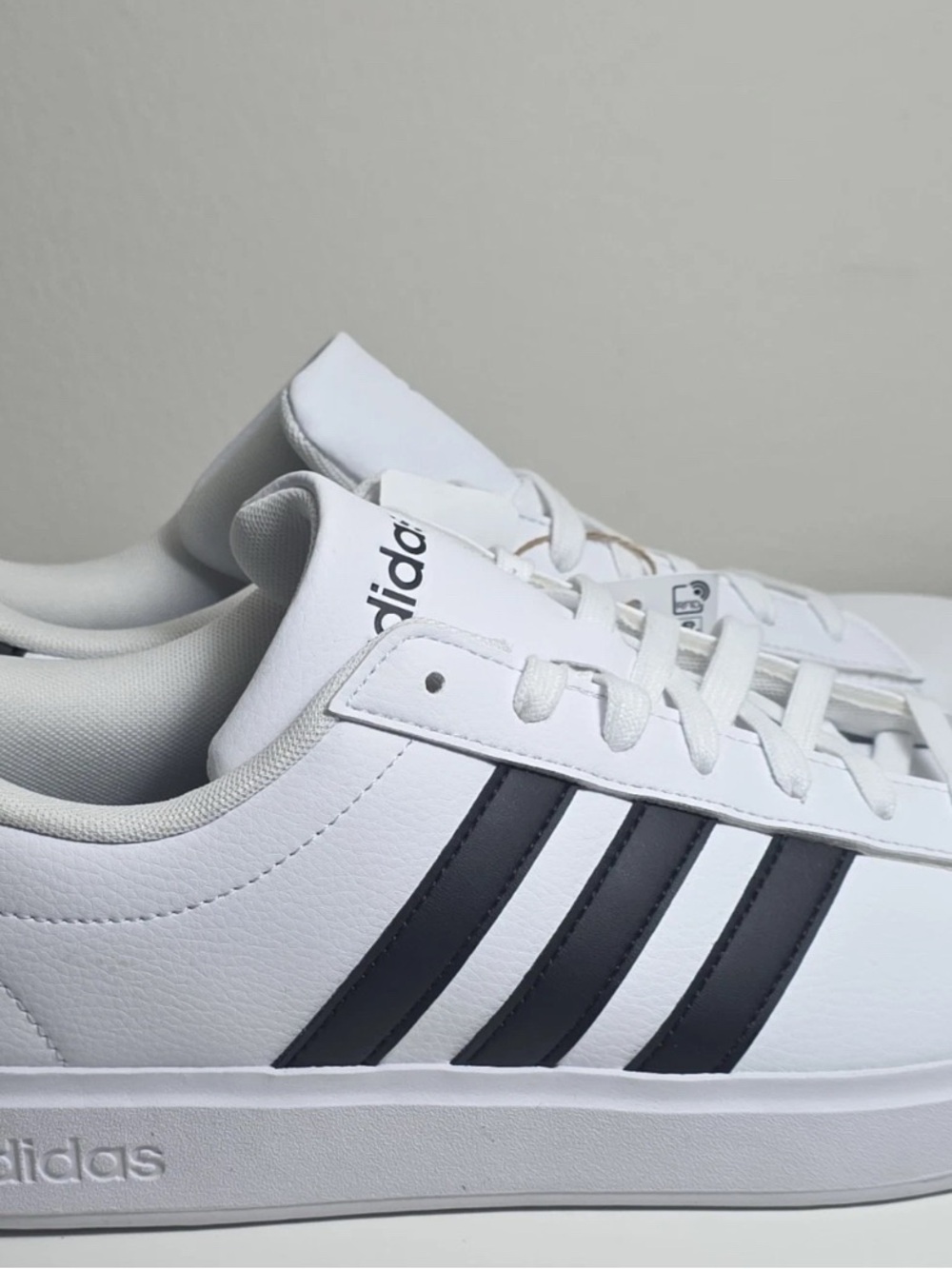 adidas White Low-Top Sneakers with Black Three Stripes